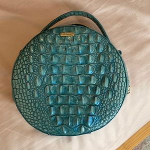 Circular teal crocodile handbag